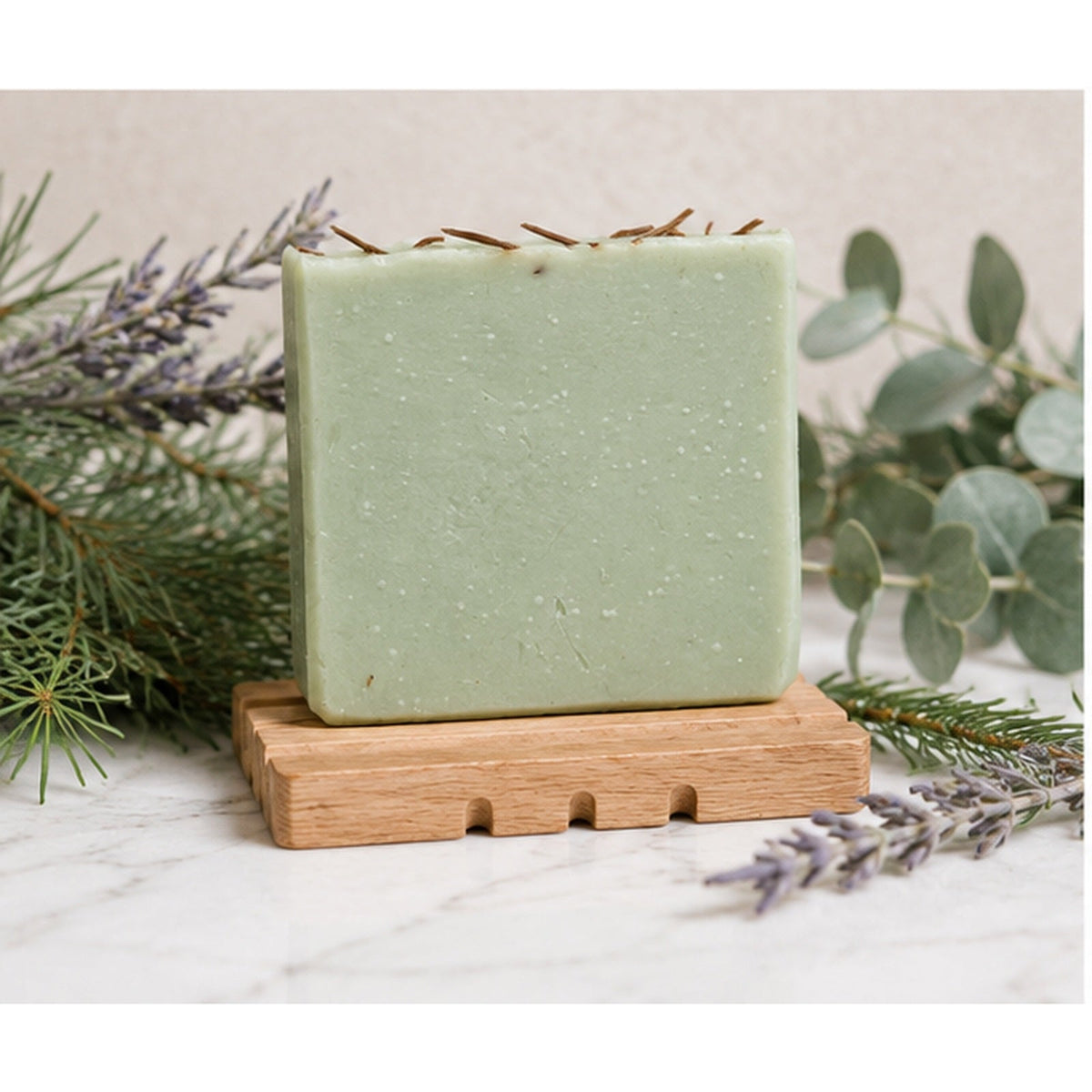 Grounded Alpine soap styled with botanical accents