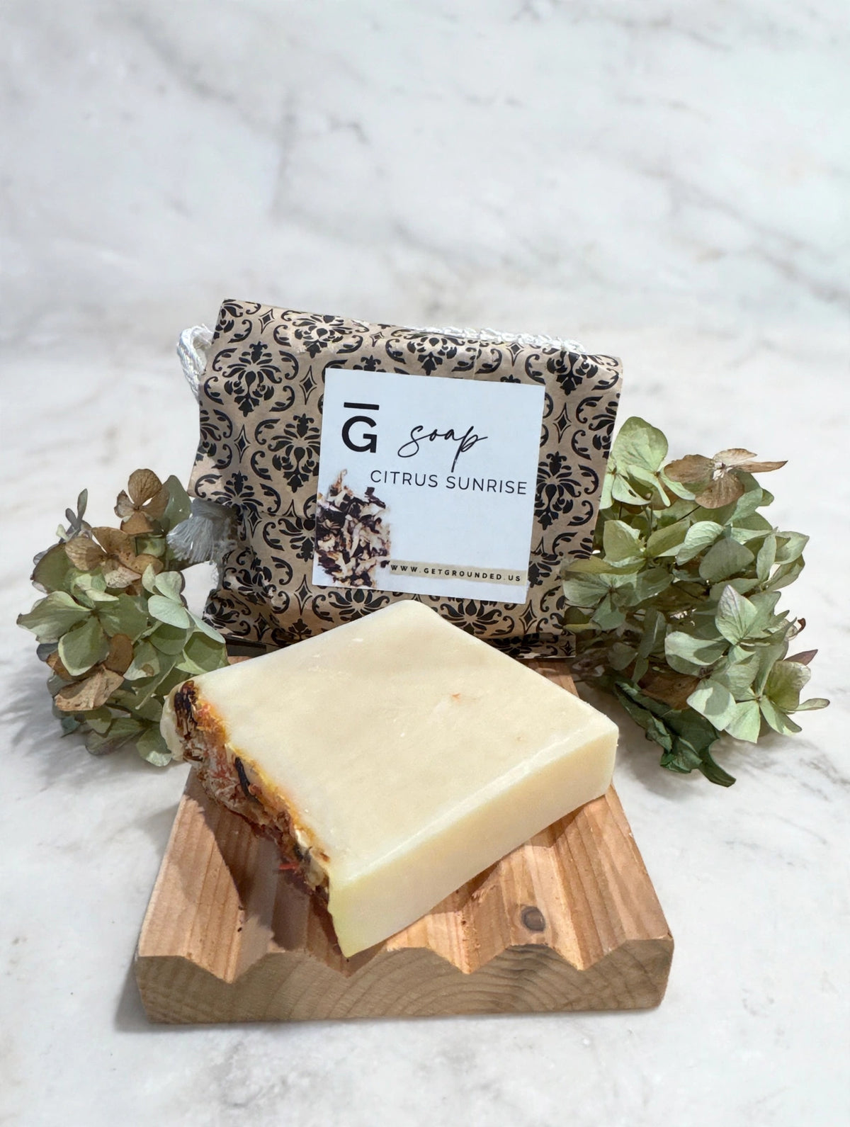 Citrus Sunrise tallow soap bar with blue butterfly pea, citrus and jasmine on marble