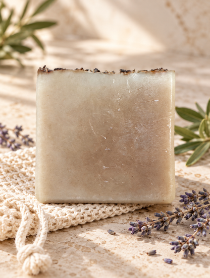 Gotu Lavender tallow soap on travertine with lavender and woven soap saver